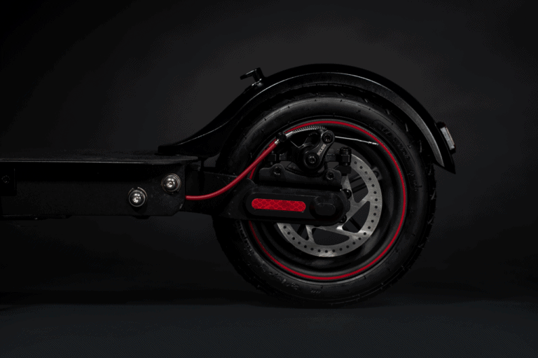 electric scooter rear wheel in black and red, side shot