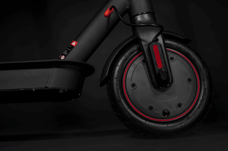 electric scooter front wheel in black and red, side shot