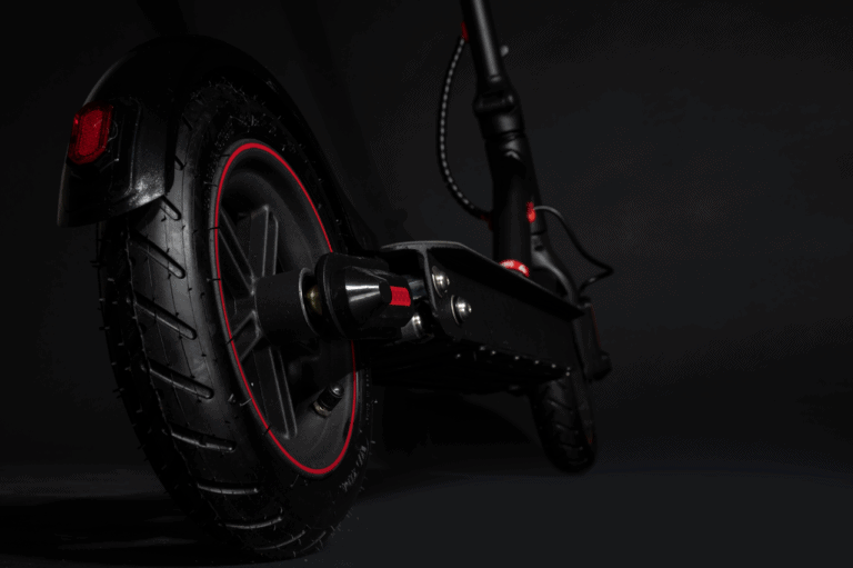 black electric scooter rear wheel close up