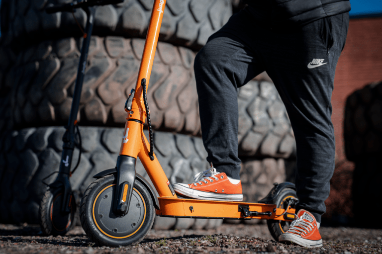 orange electric scooter jungle one from side angle