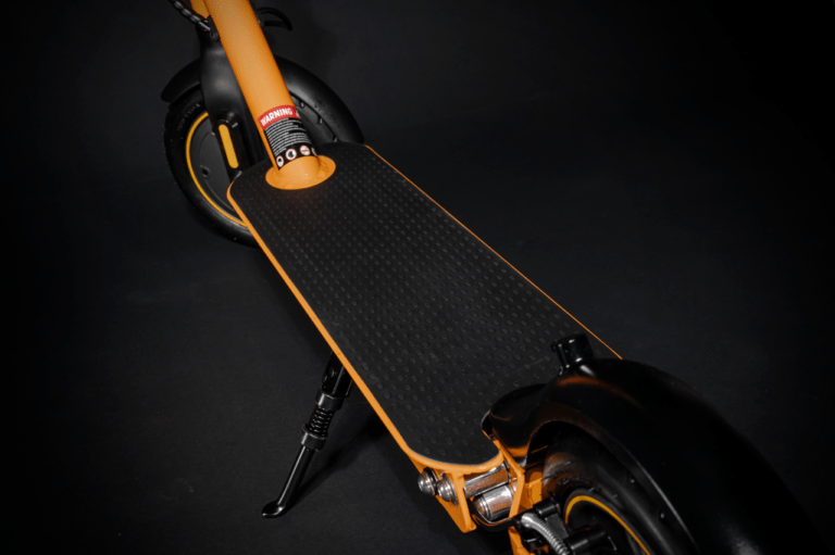 close up of electric scooter foot stand orange