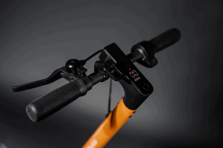 close up of electric scooter handlebar orange