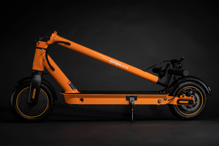 orange folded electric scooter studio shot on black background